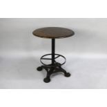 An Iron Based Circular Topped Pub Table with Four Moulded Claw Feet, 59cms Diameter and 70cms High