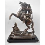 An American Bronzed Spelter Figure Group of Mounted Cowboy Firing Revolver on Ebonized Wooden