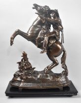 An American Bronzed Spelter Figure Group of Mounted Cowboy Firing Revolver on Ebonized Wooden