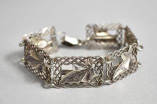 A Sterling Silver Seven Framed Bracelet by Ward Brothers, Birmingham, Leaves Against Entwined