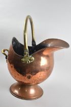 A Vintage Copper and Brass Helmet Shaped Coal Scuttle with Loop Handle, 50cms High