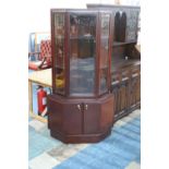 A Turnidge Corner Display Cabinet of Canted Form with Cupboard Base