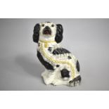 A 19th Century Staffordshire Spaniel, 24cm high