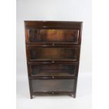 A Mid 20th Century "Angus" Four Tier Bookcase with Glazed Up and Over Doors, 86cms Wide by 25cms