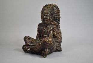 A Cast Resin Study of Seated American Indian Chief with Feather Headdress, 30cms High