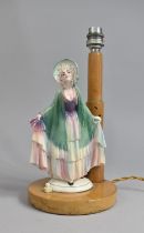 A Mid 20th Century Figural Table Lamp, Ceramic Lady on Wooden Lamp Base with Stepped Lamp Support,