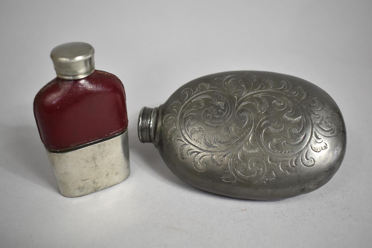 Two Hip Flasks, Larger being a Pewter Example with Scrolled Decoration, Smaller with Leather top