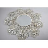A Circular Metal and Perspex Wall Mirror in the Form of Flower Petals, 55cms Diameter