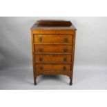 An Edwardian Oak Four Drawer Chest, 73cms Wide and 107cms High
