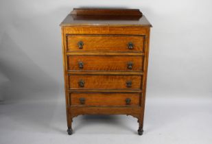 An Edwardian Oak Four Drawer Chest, 73cms Wide and 107cms High