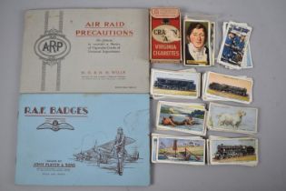 A Small Collection of Loose Cigarette Cards, together with two albums, RAF Badges and Air Raid