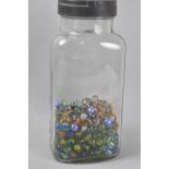 A Vintage Glass Sweet Jar Containing Marbles