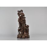 A Chinese Root Carving with Wire Inlay, Shou with Staff and Peaches, Attendant, Recumbent Stag and