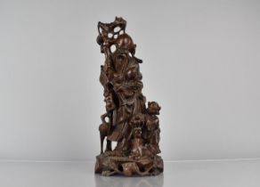 A Chinese Root Carving with Wire Inlay, Shou with Staff and Peaches, Attendant, Recumbent Stag and