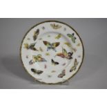 A Japanese Porcelain Plate Decorated with Hand Painted Butterflies in Polychrome Enamels, Signed