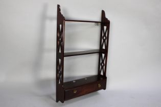 A Modern Mahogany Wall Hanging Shelf Unit with Pierced Supports and Single Base Drawer, 41cms Wide