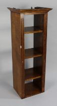 A Mid 20th Century Narrow Oak Bookcase with Three Adjustable Shelves and Galleried Back, 44cms