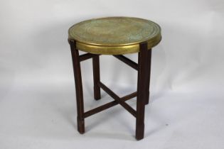 A Mid 20th Century Indian Brass Reversible Benares Tray on Folding Wooden Stand, 50cms Diameter