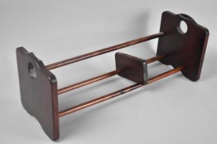 A Modern Mahogany Book Rack with Slide