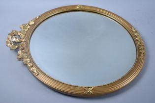 A Mid 20th Century Circular Gilt Framed Wall Mirror with Wreath and Swag Gilded Decoration, 45cms