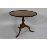 A Mid 20th Century Walnut Snap Top Tripod Coffee Table with Piecrust Border, 60cms Diameter