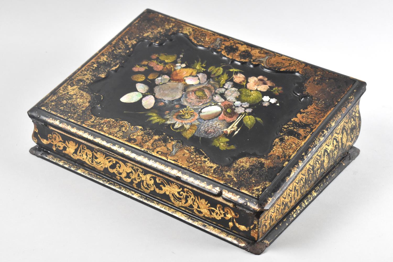A 19th Century Lacquered Writing Slope, The Lid with Mother of Pearl and Painted Decoration