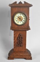 An Edwardian Novelty Mantel Clock in the Form of a Miniature Oak Long Case Clock with Removable