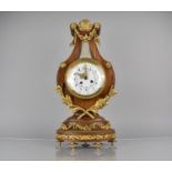 A French Ormolu Mounted Kingwood Cased Lyre Mantel Clock in the Louis XVI Style, Enamelled Dial