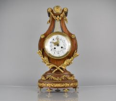 A French Ormolu Mounted Kingwood Cased Lyre Mantel Clock in the Louis XVI Style, Enamelled Dial