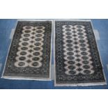 Two Patterned Rugs, 156x97 and 143x93cms