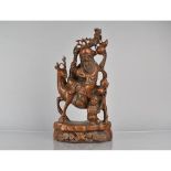 A Chinese Root Carving Depicting Shou with Staff and Peach Riding Stag with Attendant to side,