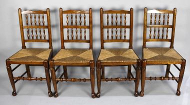 A Set of Four Rush Seated Spindle Back Dining Chairs