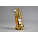 A Modern Miniature Brass Novelty Desk Top Clock in the Form of a Bag of Golf Clubs, 7cms High