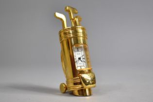 A Modern Miniature Brass Novelty Desk Top Clock in the Form of a Bag of Golf Clubs, 7cms High