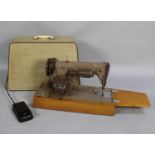 A Vintage Electric Singer Sewing Machine with Foot Pedal and Power Cable