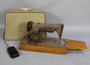 A Vintage Electric Singer Sewing Machine with Foot Pedal and Power Cable