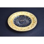 A Gilt Metal and Glass Circular Dish, Rim with Relief Decoration, Flowers, 12.5cms Diameter by