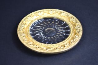 A Gilt Metal and Glass Circular Dish, Rim with Relief Decoration, Flowers, 12.5cms Diameter by