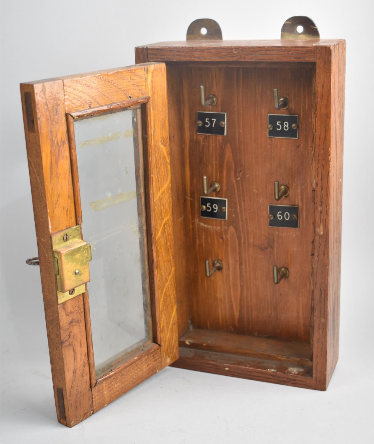 An Early/ Mid Wooden Wall Hanging Key Box with Glazed Hinged Door having Lock and Key to Six Hook