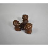 A Cast Chinese Bronze Study of Three Pigs Playing Cards, 4.5cm high