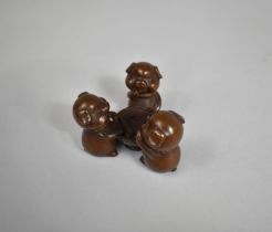 A Cast Chinese Bronze Study of Three Pigs Playing Cards, 4.5cm high