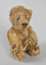 A Small Schuko Jointed Teddy Bear with Removable Head Revealing Cylindrical Glass Flask, 12cms High