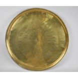 A Large Circular Middle Eastern Tray with Islamic Engraving, 57cms Diameter