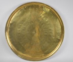 A Large Circular Middle Eastern Tray with Islamic Engraving, 57cms Diameter