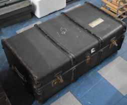 A Vintage Metal banded Travelling Trunk with Vintage Luggage Railway Label (Condition Issues)