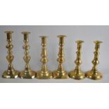 A Collection of Three Pairs of Victorian Candlesticks, all with Pushers