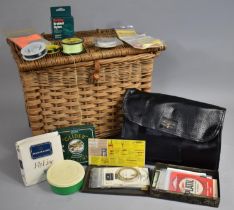 A Vintage Wicker Fishing Creel Containing Angling Accessories Such as Fishing Lines and Leaders,