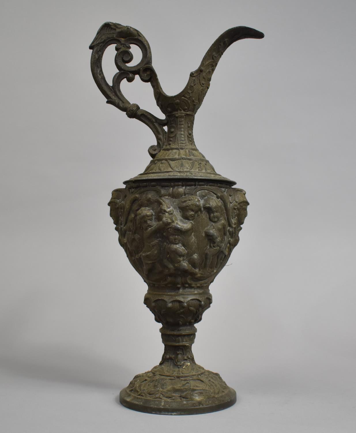 A Large Metal Continental Claret Jug, The Body Decorated in Heavy Relief Depicting Cherubs Playing - Image 2 of 2