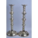 A Pair of Brass "King of Diamond" Style Candlesticks, Circular Bases with Engraved Decoration, 32cms