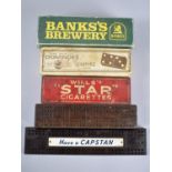 A Collection of Two Vintage Cribbage Boards and Three Boxed Sets of Advertising Dominoes